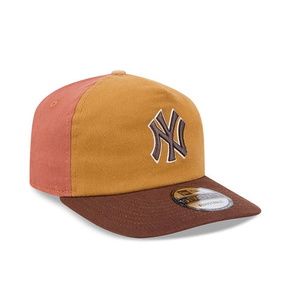 New York Yankees MLB Fall Story Multi New Era 19TWENTY Adjustable Cap, three-quarter view showing raised brown embroidered NY logo on a mustard yellow front panel, brown flat visor with 19TWENTY size sticker, and contrasting rust-coloured side panel.