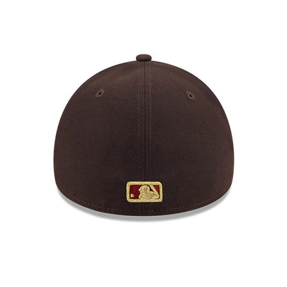 Yankees MLB Fall Story Dark Brown New Era 59FORTY A-Frame Fitted Cap, rear view showing the gold embroidered MLB Batterman logo at the centre back of the dark brown panels, with matching eyelets and a top button on the structured crown.