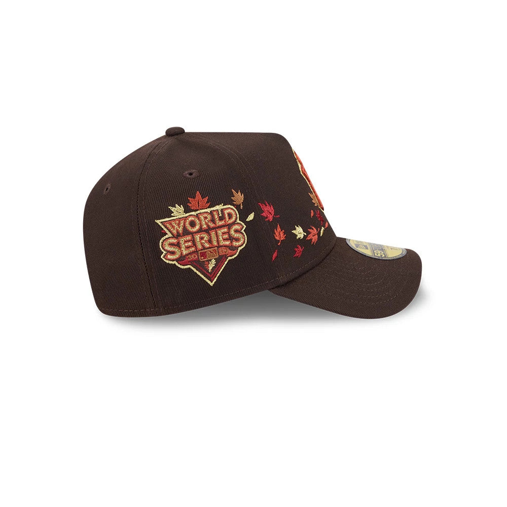 Yankees MLB Fall Story Dark Brown New Era 59FORTY A-Frame Fitted Cap, side view showing the embroidered World Series logo with autumn leaves on the dark brown crown, set above a flat visor with a 59FORTY size sticker on the visor.