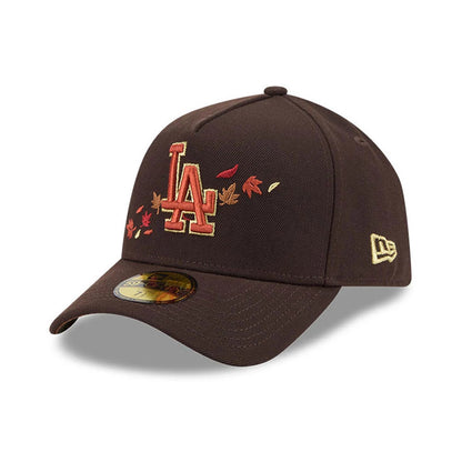 LA Dodgers MLB Fall Story Dark Brown New Era 59FORTY A-Frame Fitted Cap, three-quarter view showing the brown crown with an embroidered LA logo and autumn leaf design on the front panel, a gold New Era flag logo on the left side.