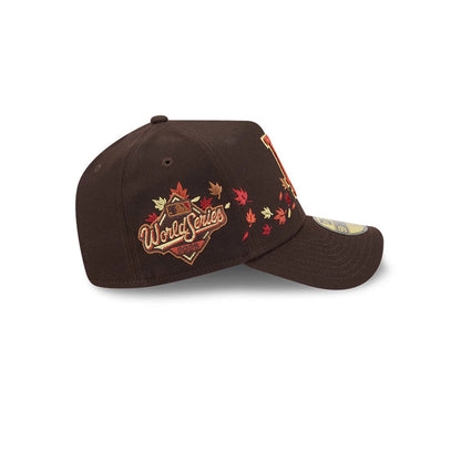 LA Dodgers MLB Fall Story Dark Brown New Era 59FORTY A-Frame Fitted Cap, side view showing an embroidered World Series 1988 logo with autumn leaves on the side panel, a structured dark brown crown, and a gold 59FORTY size sticker on the visor.