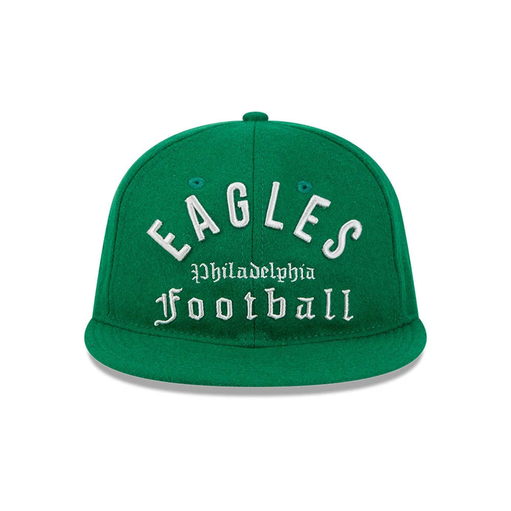 Eagles NFL Historic Arch Green Retro Crown New Era 59FIFTY Fitted Cap, front view showing white raised embroidery with 'Eagles' arched over 'Philadelphia Football' on the structured green crown, flat green visor, and matching eyelets.