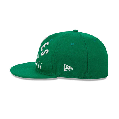 Eagles NFL Historic Arch Green Retro Crown New Era 59FIFTY Fitted Cap, side view showing the white embroidered New Era flag logo on the left side, a structured green crown with matching eyelets, and a flat green visor.