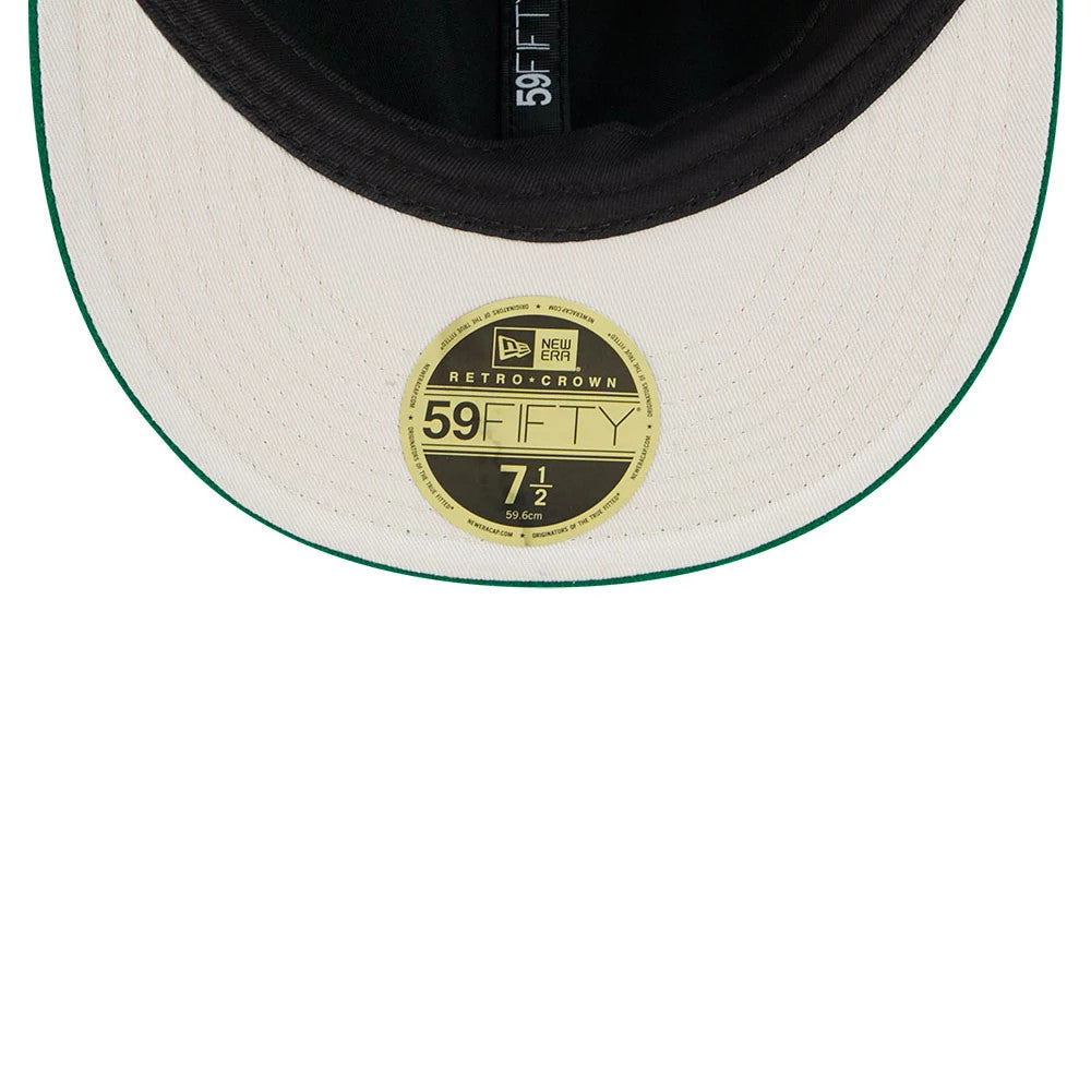 Eagles NFL Historic Arch Green Retro Crown New Era 59FIFTY Fitted Cap, inside view displaying a black sweatband, the white undervisor with green edge, and a gold 59FIFTY size sticker on the underside of the flat visor.
