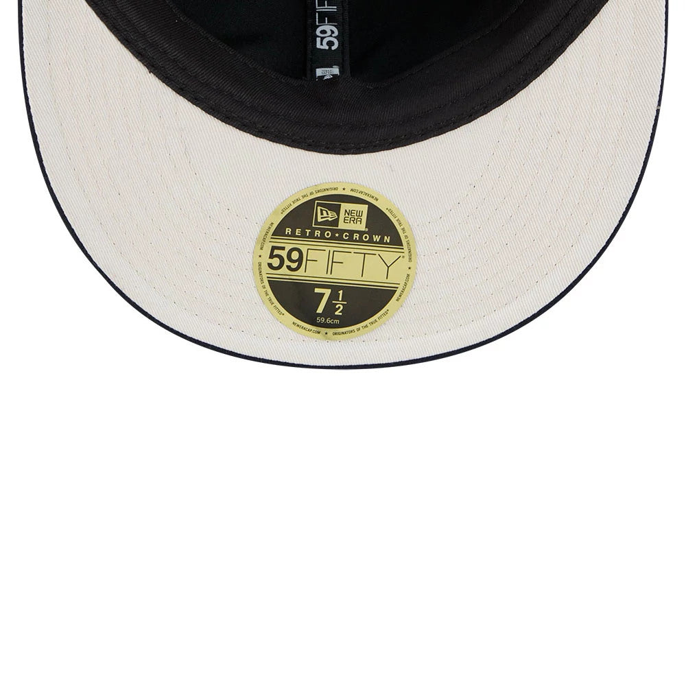 Dallas Cowboys NFL Historic Arch Dark Blue Retro Crown New Era 59FIFTY Fitted Cap, inside view showing a black sweatband, a cream undervisor with stitching, and a gold 59FIFTY size sticker in the centre towards the bottom edge.