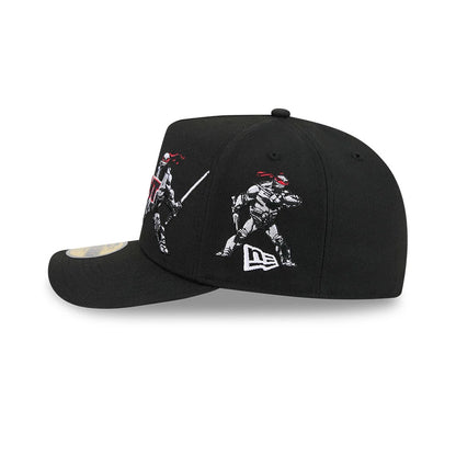Teenage Mutant Ninja Heroes Black New Era 59FIFTY A-Frame Fitted Cap, side view showing embroidered graphics of two ninja figures with red masks on the right side panel, and the white New Era flag logo below on the structured black crown.