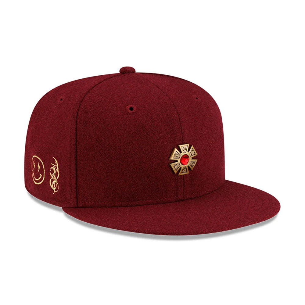 Pictured is this New Era X J Balvin & Ryan Castro Omerta New Era 59FIFTY Fitted cap in dark red. 1