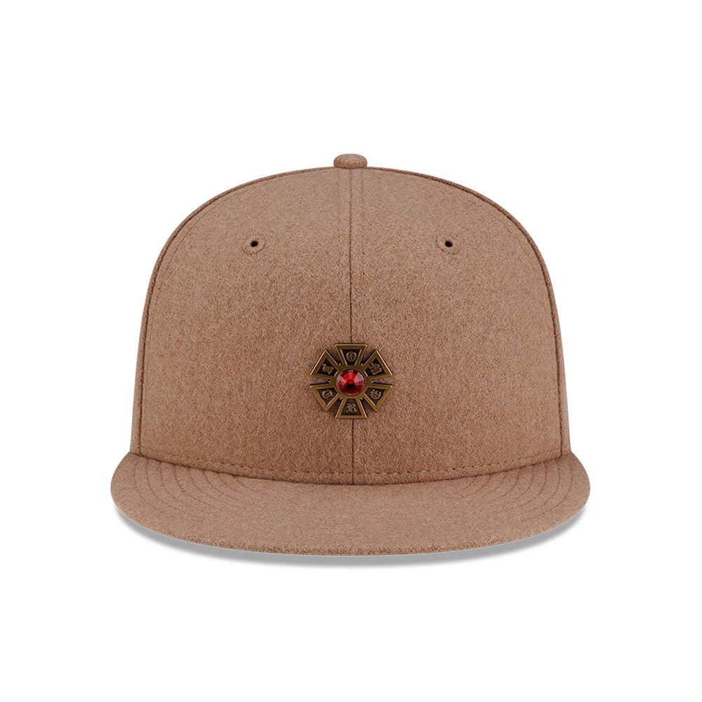 New Era X Omerta Balvin Beige New Era 59FIFTY Fitted Cap, inside view showing the black 59FIFTY branded taping, a contrasting black sweatband, and a beige undervisor with detailed stitching across the full surface.