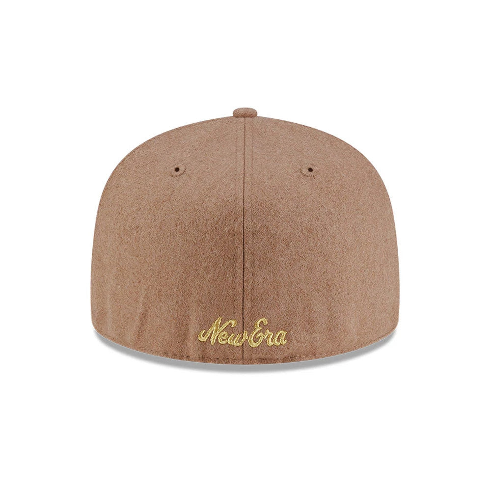 New Era X Omerta Balvin Beige New Era 59FIFTY Fitted Cap, rear view showing the gold embroidered New Era script logo centred low on the structured beige crown, with matching eyelets and a top button for a cohesive look.