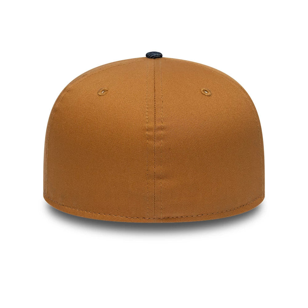 Williams Team Austin Race Special Navy New Era 59FIFTY Fitted Cap, rear view showing a plain mustard brown back panel with matching eyelets and no logos, topped with a contrasting navy blue button on the structured crown.