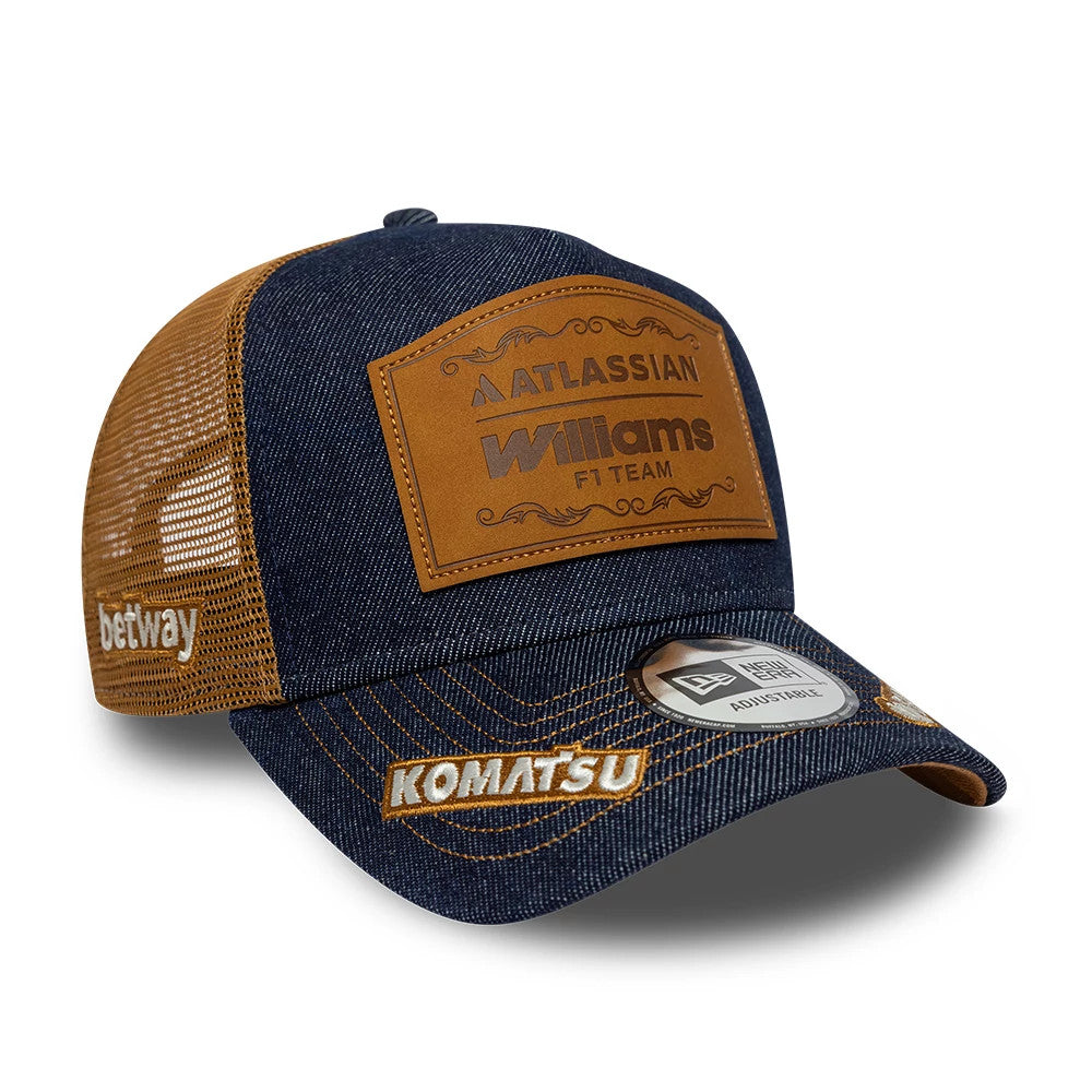 Williams Team Austin Race Special Navy New Era 9FORTY E-Frame Trucker Adjustable Cap, three-quarter view showing the leather-effect front patch with Williams F1 Team text, brown mesh side panels.
