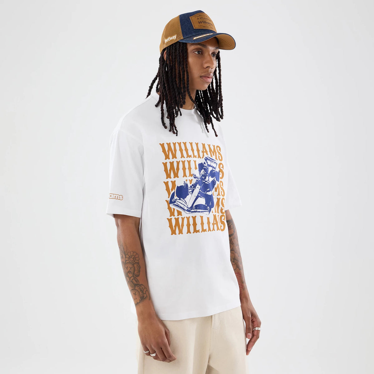 The model is wearing this Williams Austin Race Special Graphic Oversized T-Shirt in white. 6