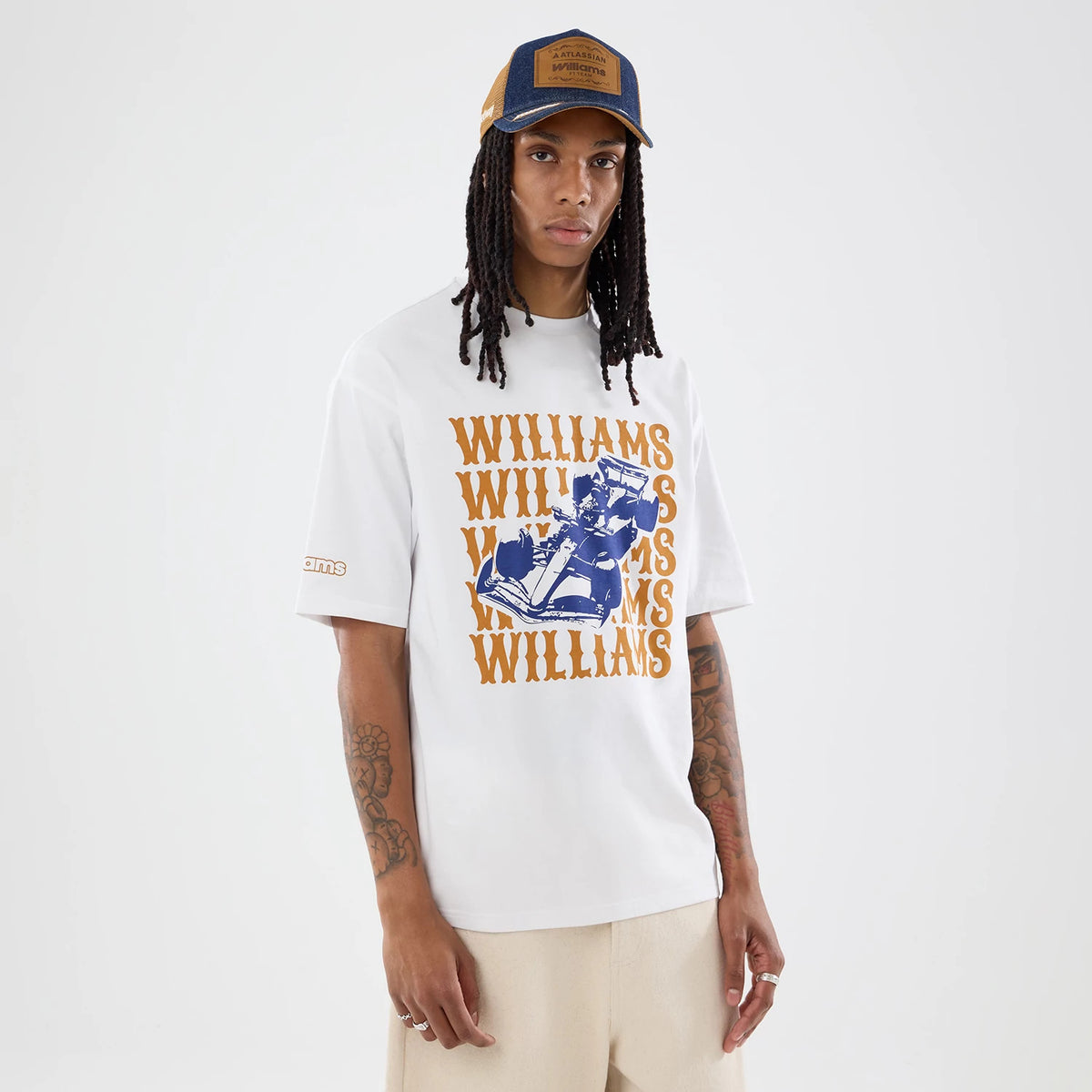 The model is wearing this Williams Austin Race Special Graphic Oversized T-Shirt in white. 1