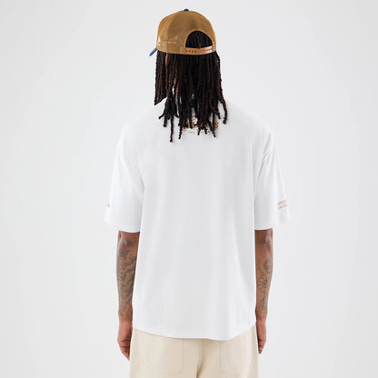 The model is wearing this Williams Austin Race Special Graphic Oversized T-Shirt in white. 2
