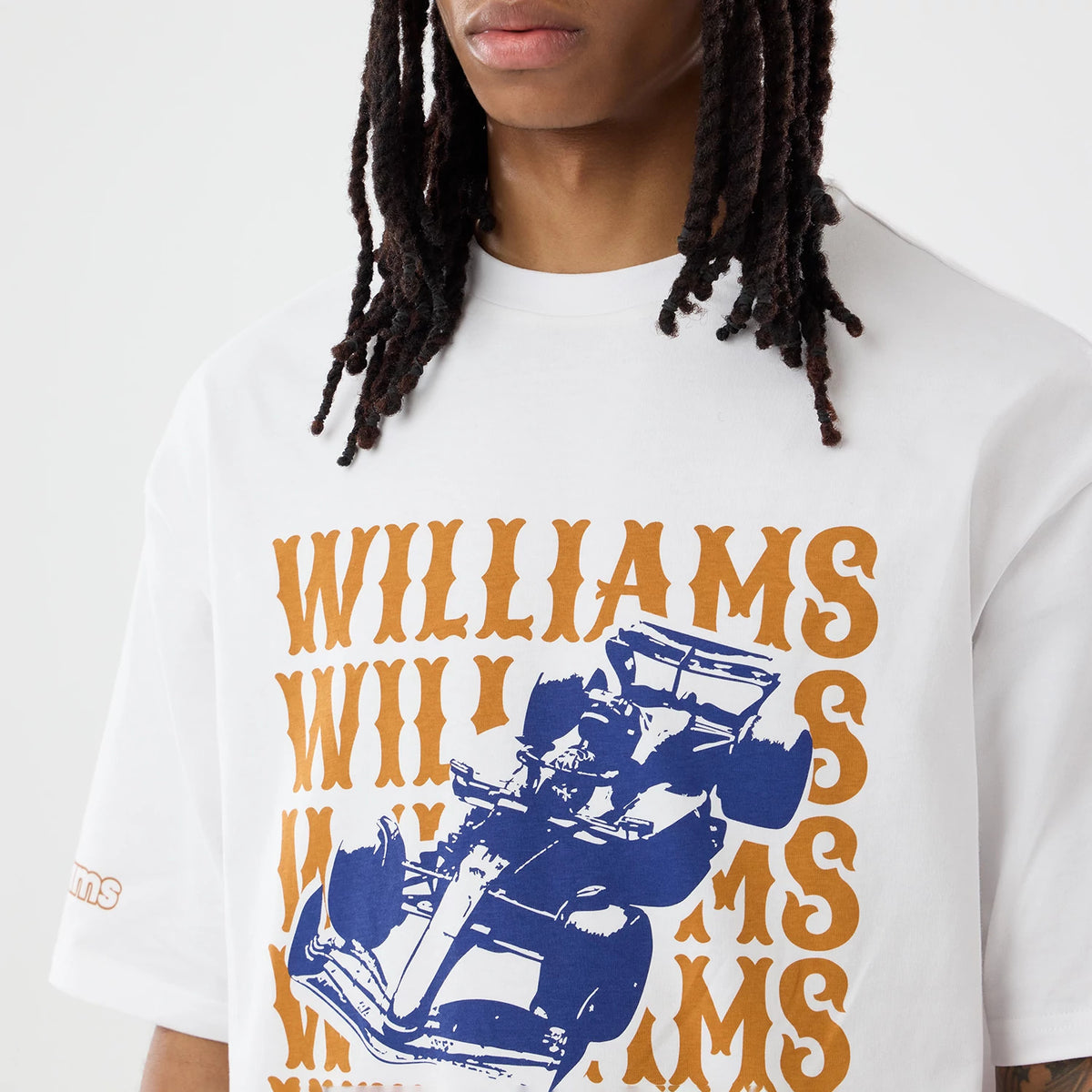 The model is wearing this Williams Austin Race Special Graphic Oversized T-Shirt in white. 7