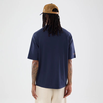 The model is wearing this Williams Austin Race Special Graphic T-Shirt in navy. 2