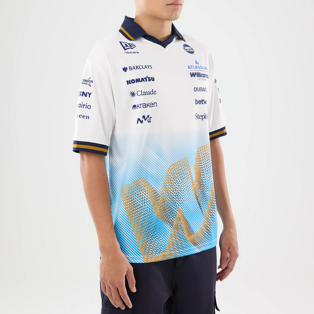 New Era Williams Spain Race Special White T-Shirt, three-quarter view showing a multicoloured gradient W pattern on the lower half, numerous sponsor logos including New Era embroidered on the chest.