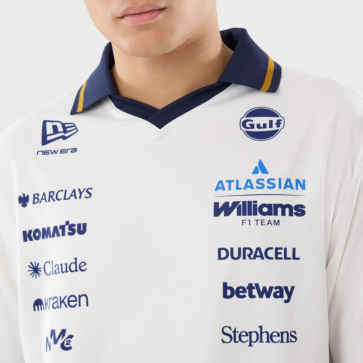 New Era Williams Spain Race Special White T-Shirt, front view on a model showcasing a white shirt with a navy collar and embroidered New Era logo on the right chest, various sponsor logos printed across the front including Gulf, Williams F1 Team.