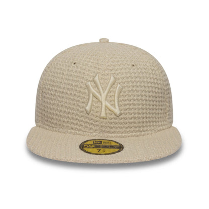Pictured is this MLB Knitted New York Yankees 59FIFTY Fitted cap in light beige. 2