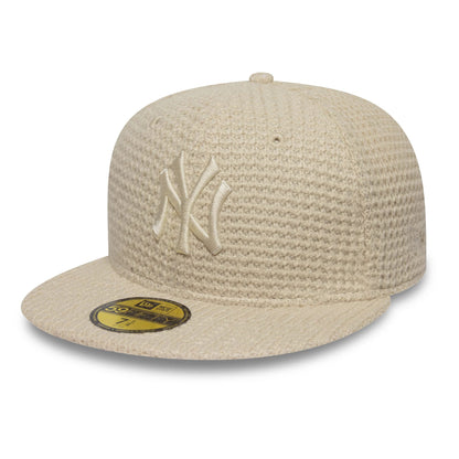 Pictured is this MLB Knitted New York Yankees 59FIFTY Fitted cap in light beige. 1