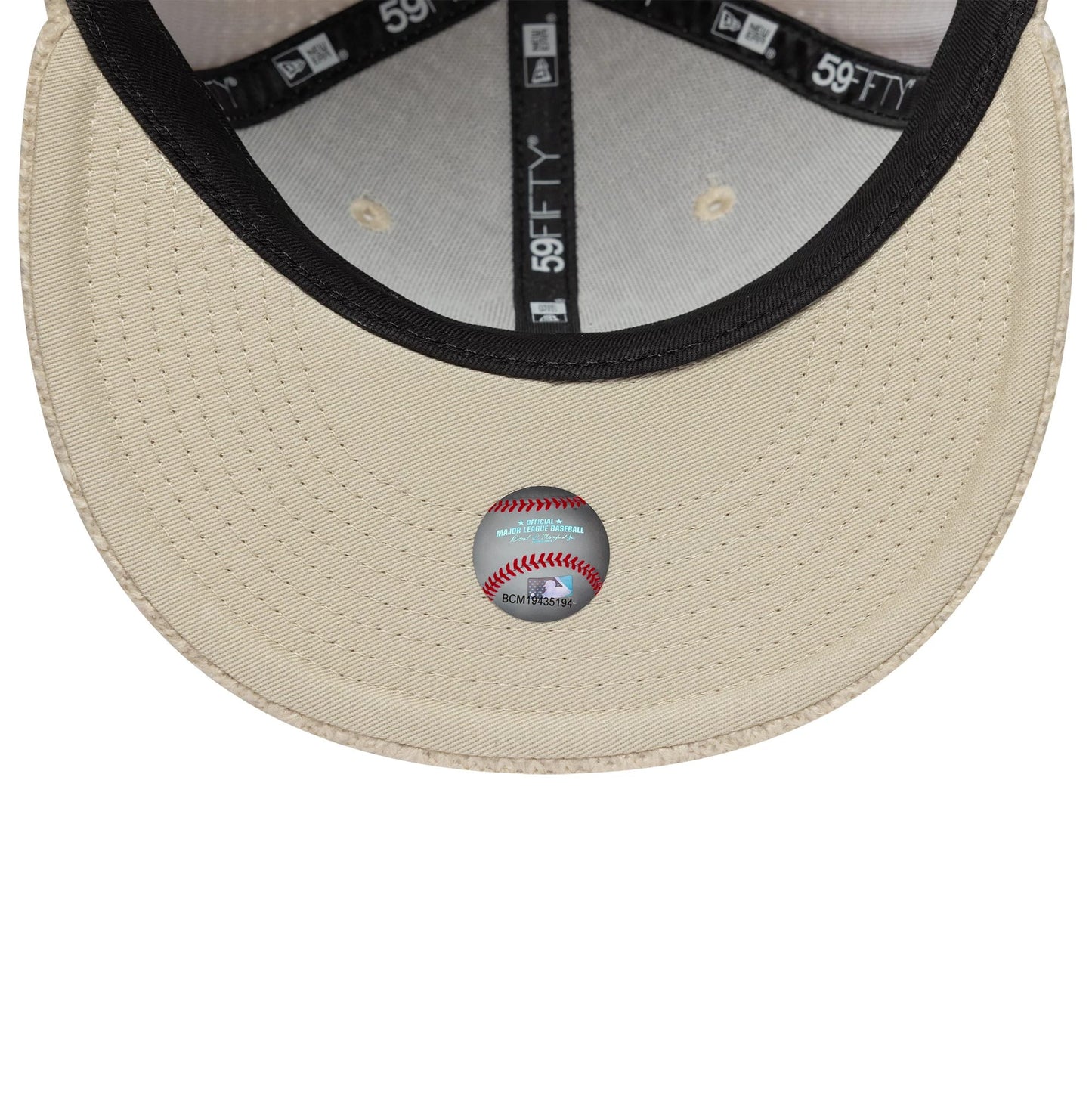 Pictured is this MLB Knitted New York Yankees 59FIFTY Fitted cap in light beige. 7