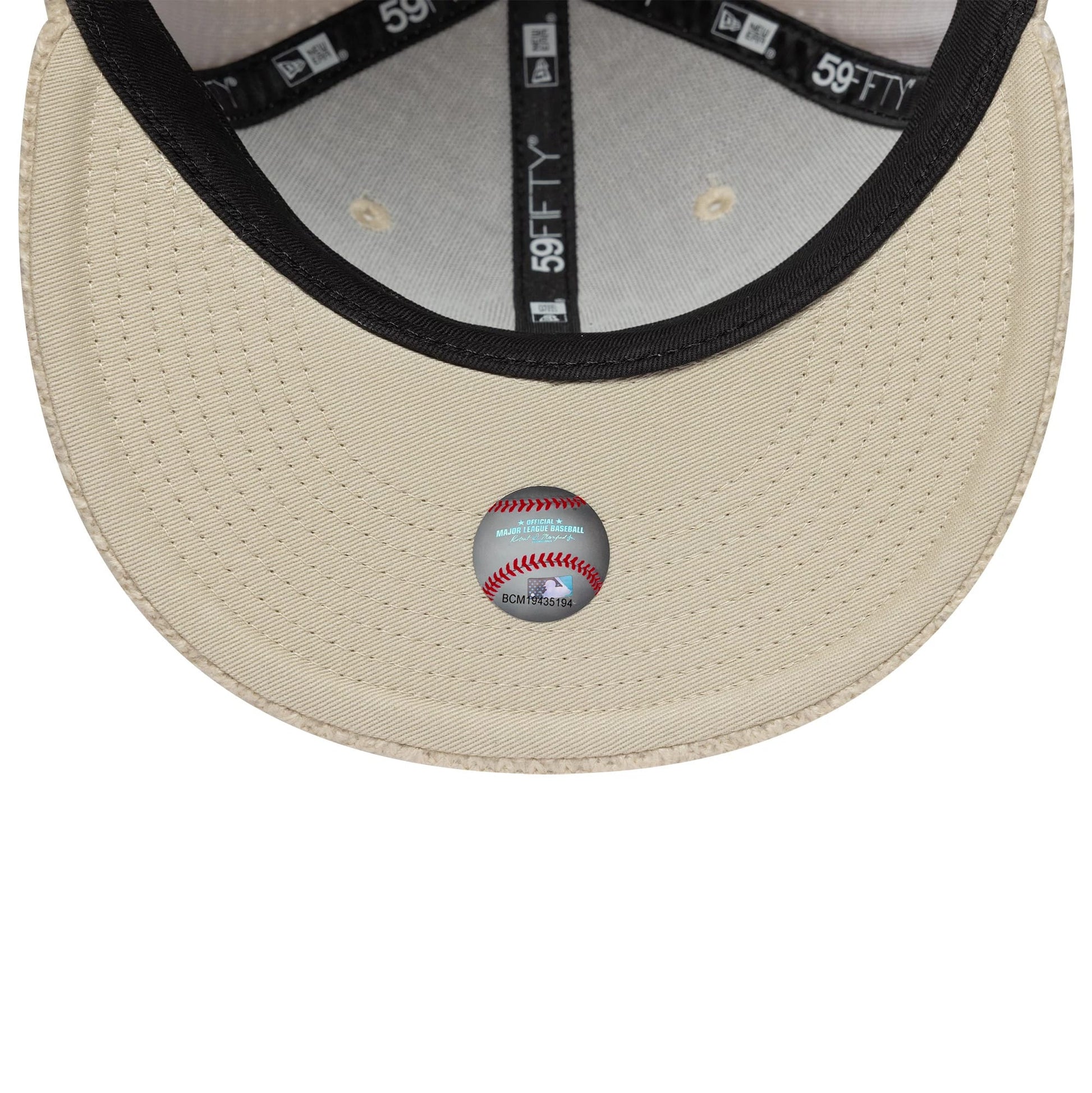 Pictured is this MLB Knitted New York Yankees 59FIFTY Fitted cap in light beige. 7