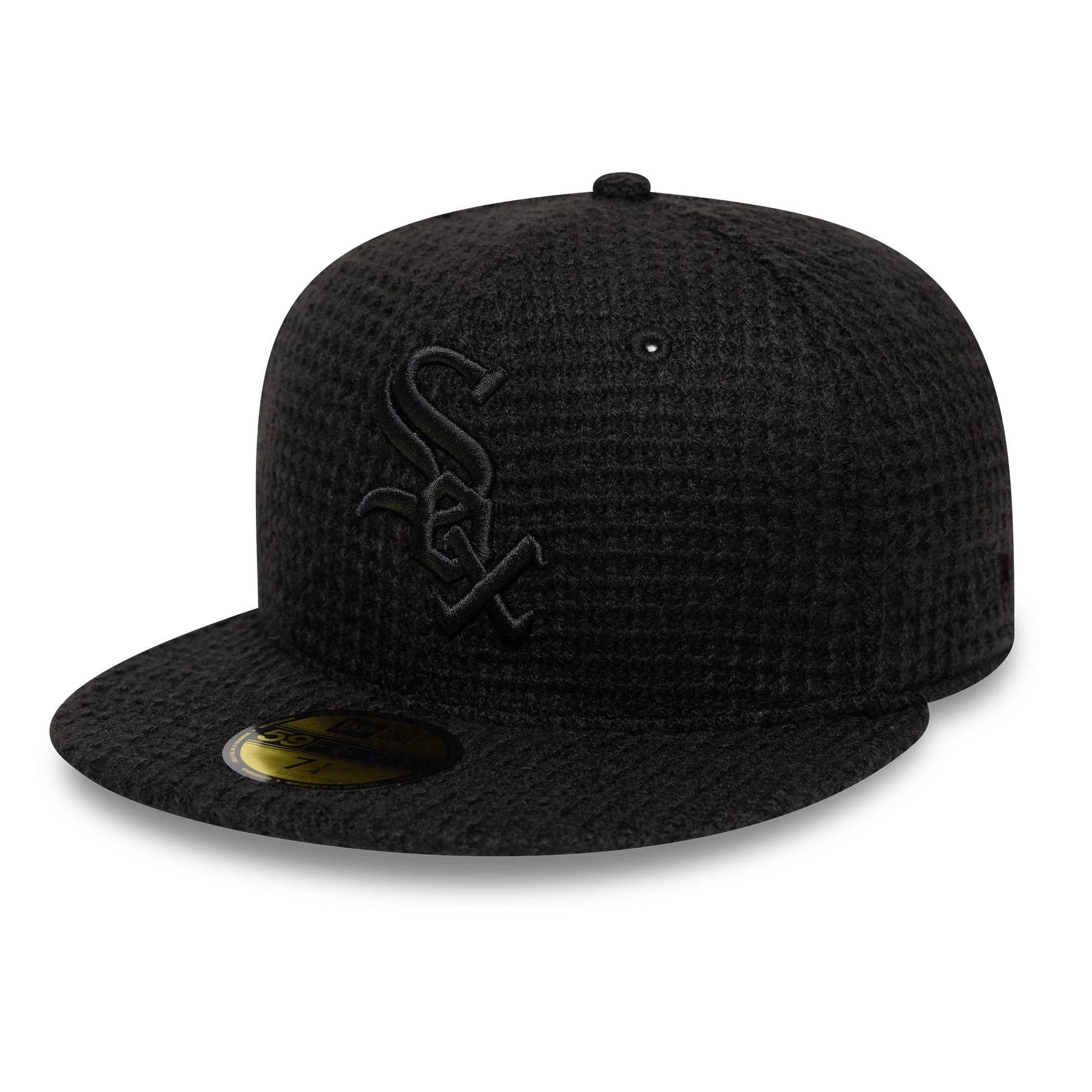 Pictured is this MLB Knitted Chicago White Sox 59FIFTY Fitted cap in black. 1