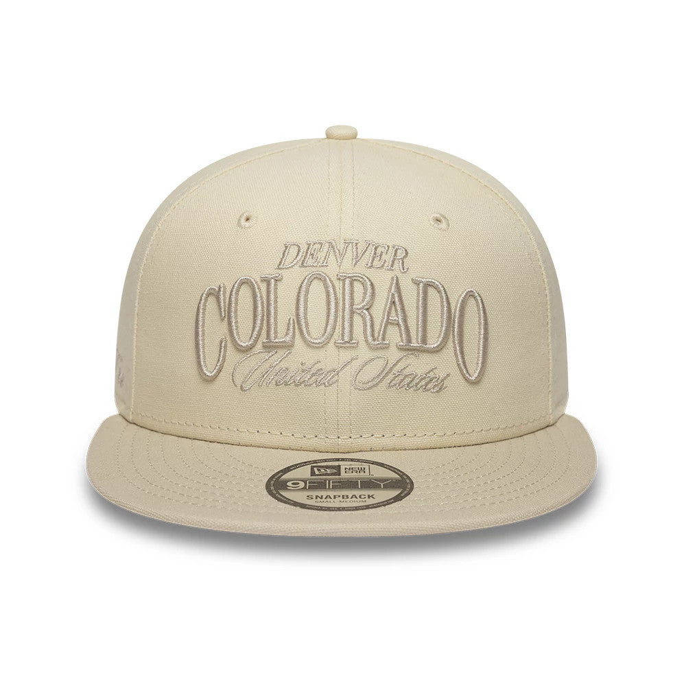 Pictured is this New Era Fabric Script 9FIFTY Snapback cap in cream. 2