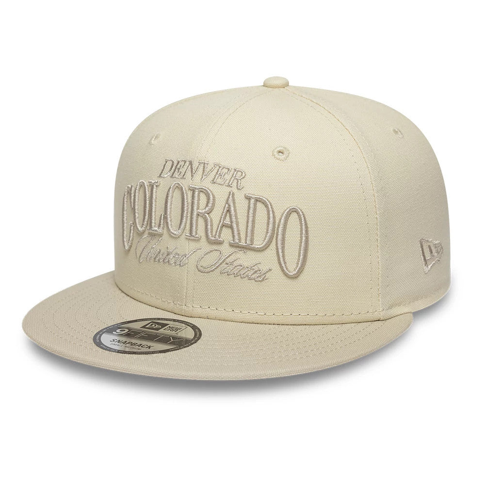 Pictured is this New Era Fabric Script 9FIFTY Snapback cap in Cream & black. 1