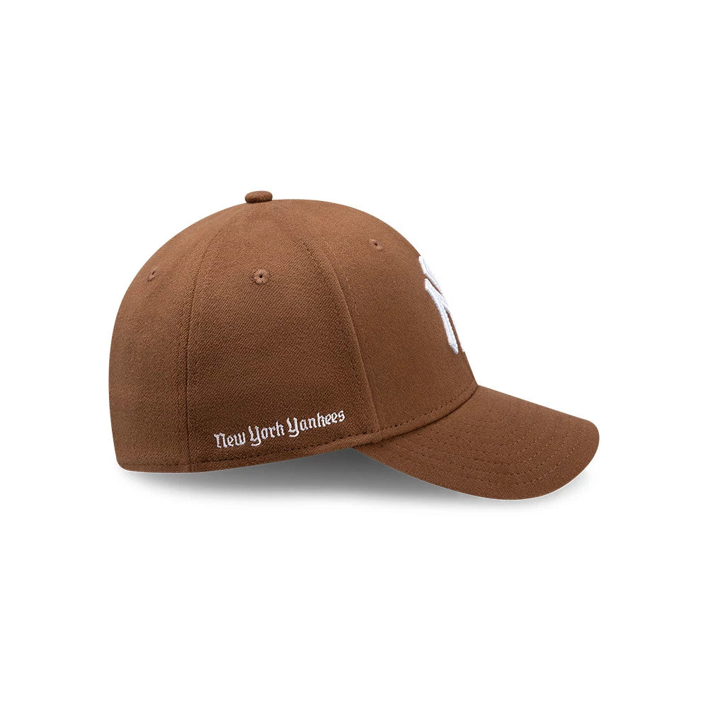 Pictured is this MLB Melton New York Yankees 39THIRTY Stretch Fit cap in brown. 5