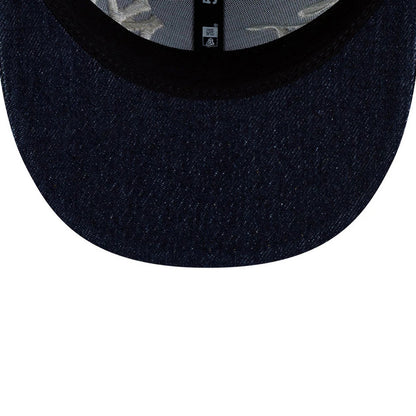 New York Yankees MLB Denim Navy Low Profile New Era 59FIFTY Fitted Cap, inside view showing the structured navy denim visor, black sweatband and grey interior taping with stitching details along the undervisor.