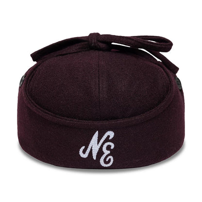 Pictured is this New Era Wool Downflap Driver cap in dark brown. 5