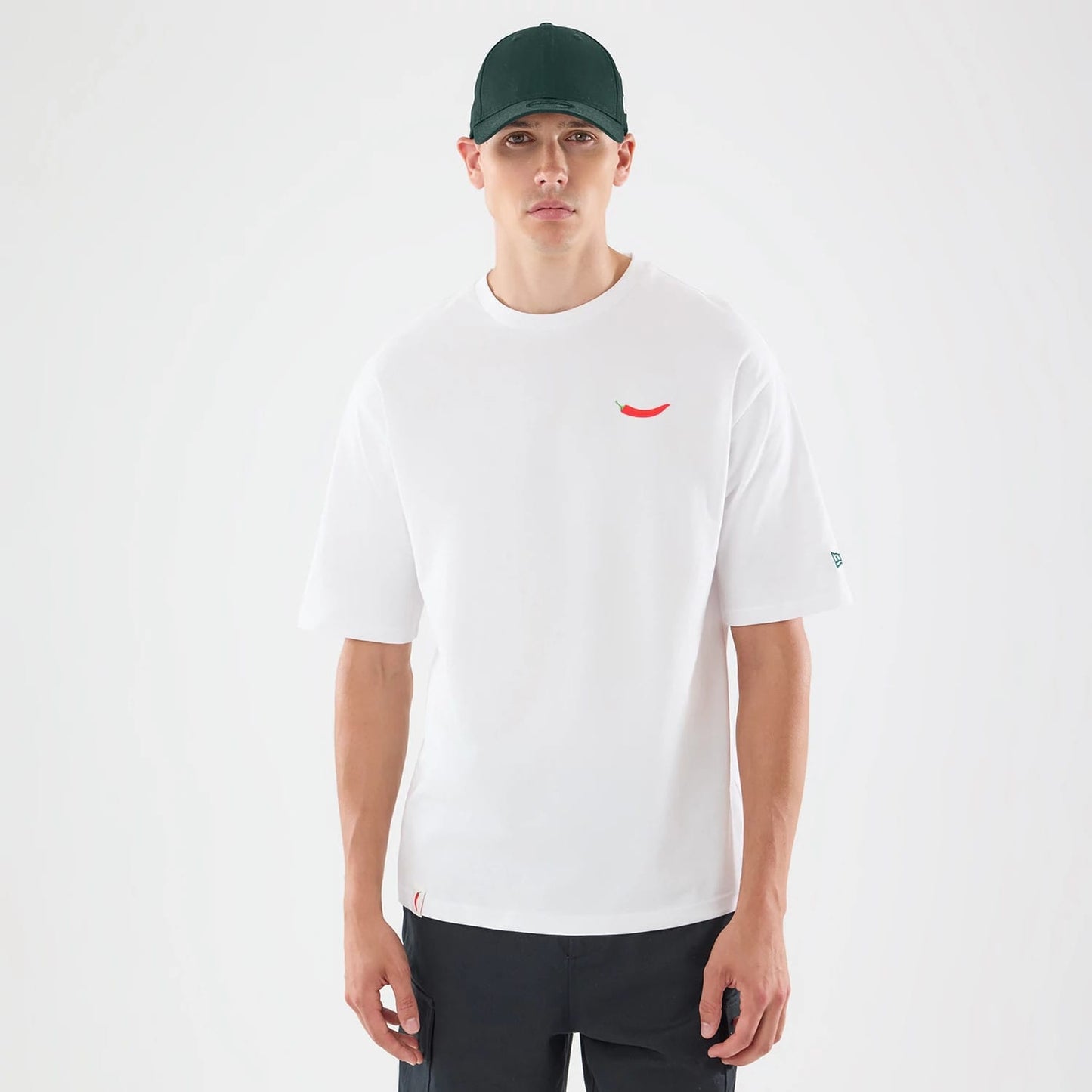 The model is wearing this Carlos Sainz Team Fifty5 Oversized T-Shirt in white. 1