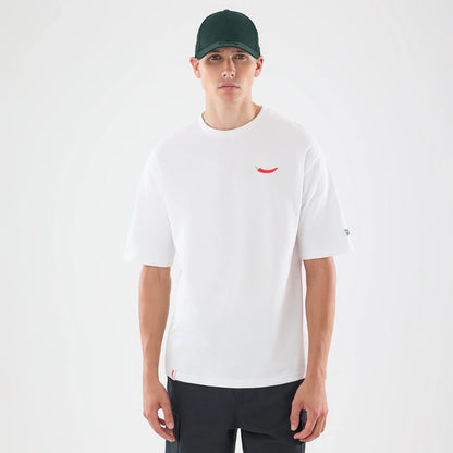 The model is wearing this Carlos Sainz Team Fifty5 Oversized T-Shirt in white. 1