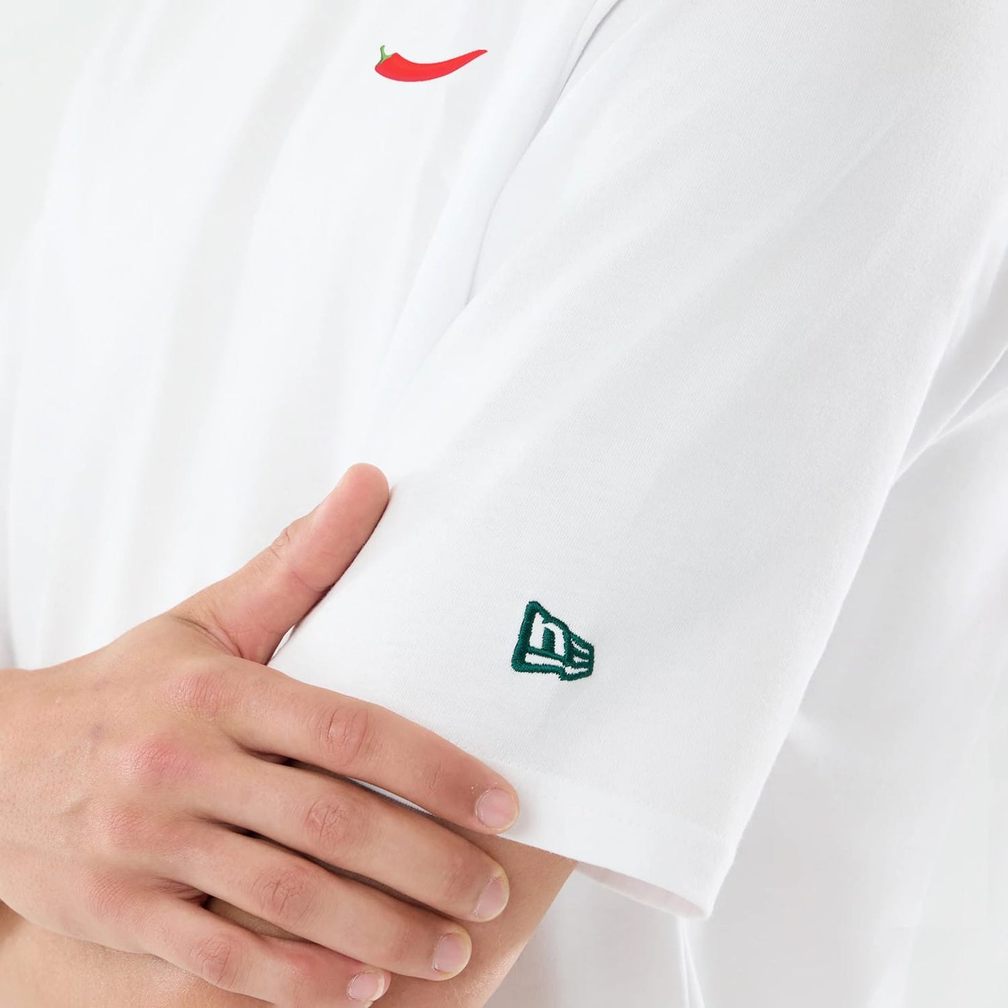 The model is wearing this Carlos Sainz Team Fifty5 Oversized T-Shirt in white. 7