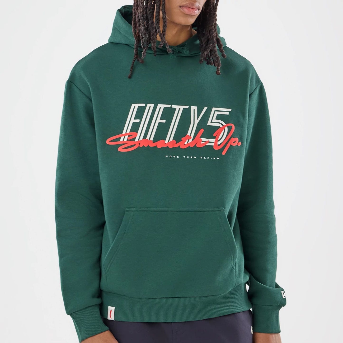 The model is wearing this Carlos Sainz Team Fifty5 Smooth Oversized Pullover Hoodie in dark green. 4