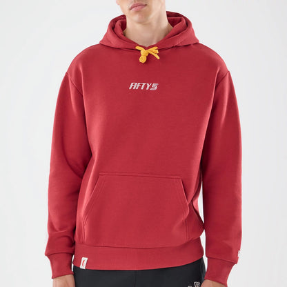 The model is wearing this Carlos Sainz Team Fifty5 Madrid Oversized Pullover Hoodie in dark red. 3