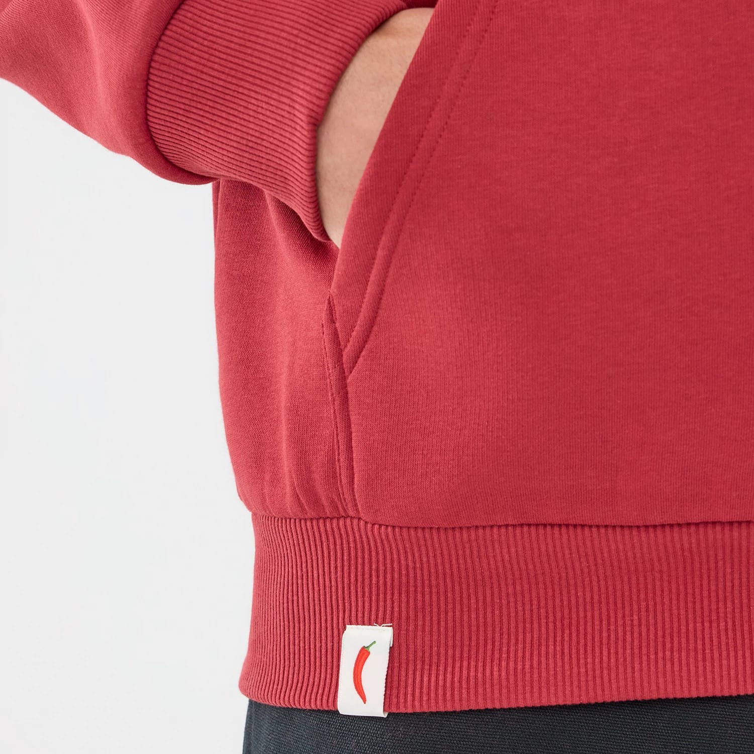 The model is wearing this Carlos Sainz Team Fifty5 Madrid Oversized Pullover Hoodie in dark red. 6