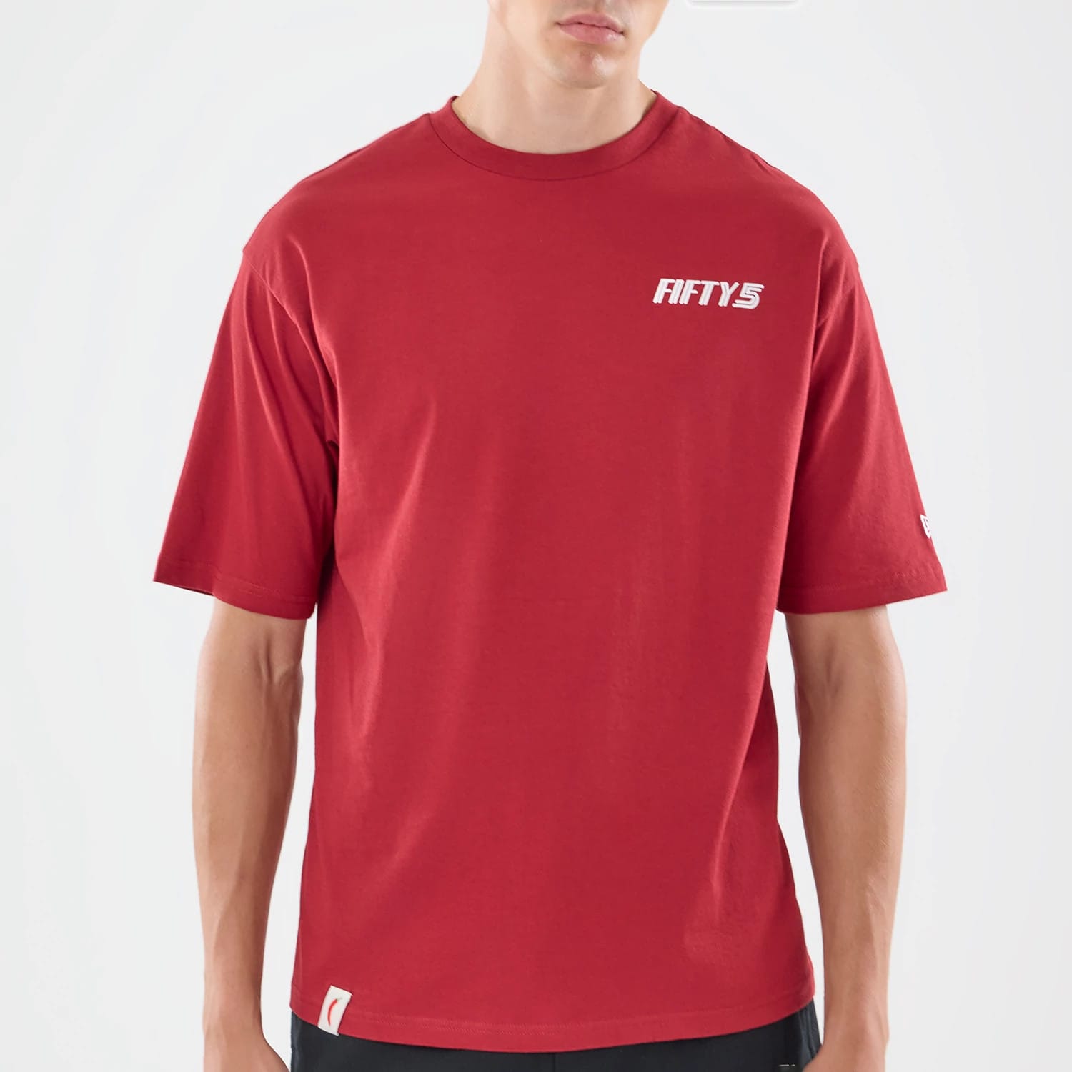 The model is wearing this Carlos Sainz Team Fifty5 Madrid Oversized T-Shirt in dark red. 3