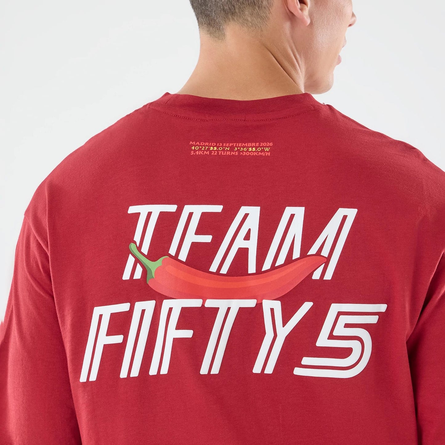 The model is wearing this Carlos Sainz Team Fifty5 Madrid Oversized T-Shirt in dark red. 7
