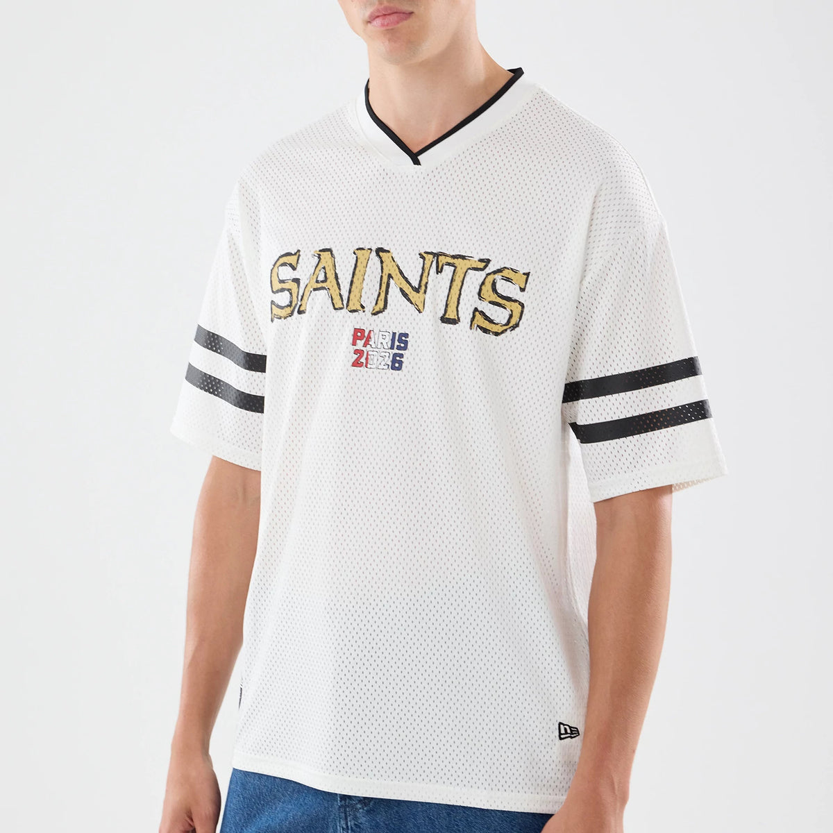The model is wearing this NFL International Games 2026 Graphic New Orleans Saints Mesh Jersey in white. 5