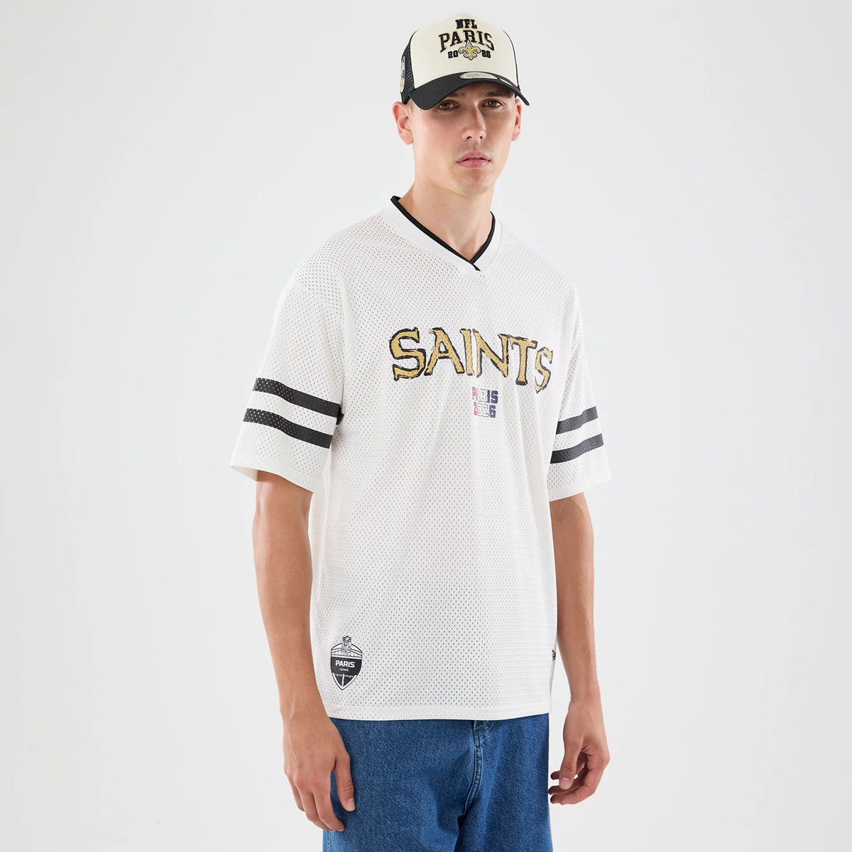The model is wearing this NFL International Series Games 2026 Graphic New Orleans Saints Mesh Jersey in white. 1