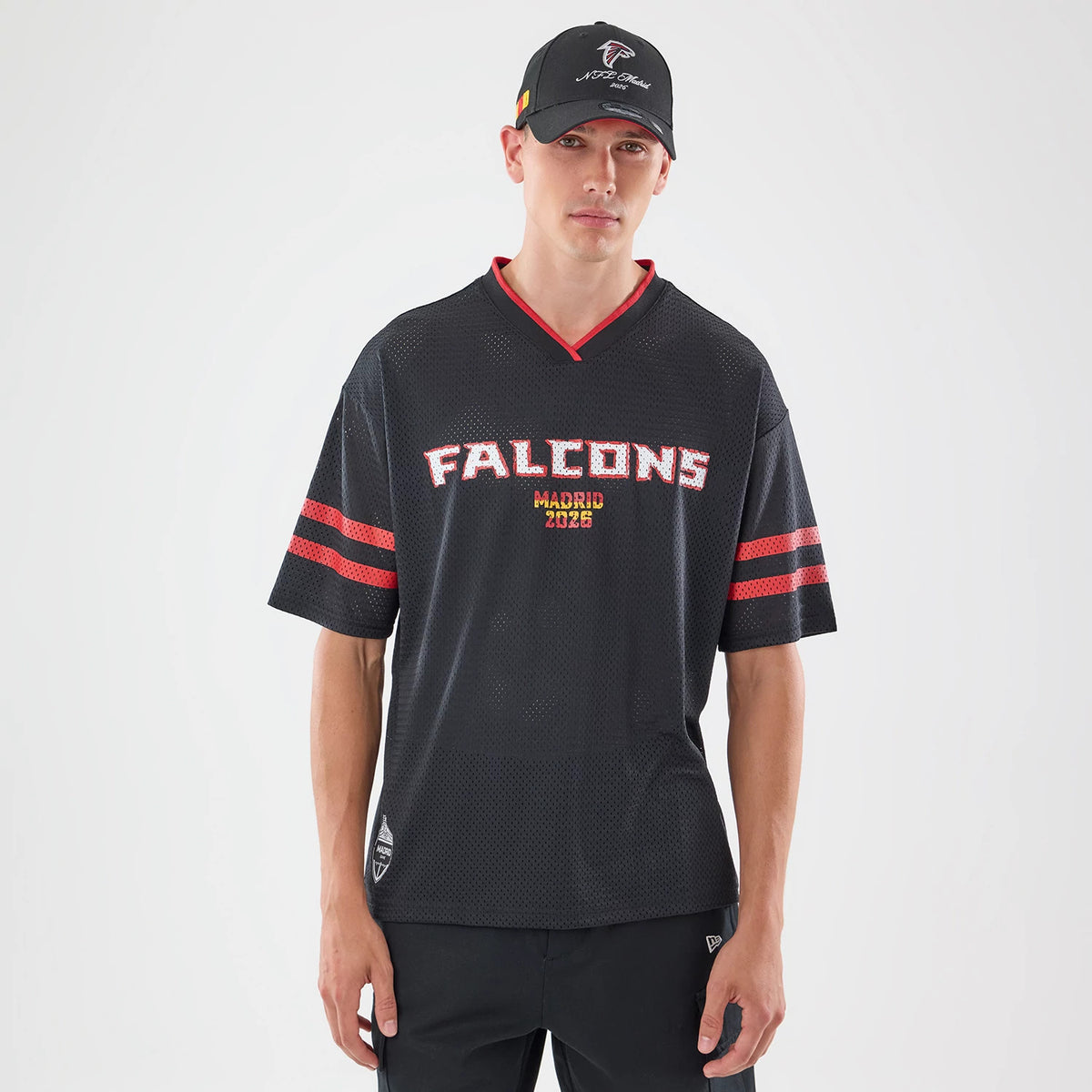 The model is wearing this NFL International Series Games 2026 Graphic Atlanta Falcons Mesh Jersey in black. 1