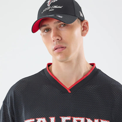 The model is wearing this NFL International Games 2026 Graphic Atlanta Falcons Mesh Jersey in black. 6