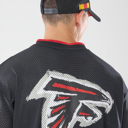 The model is wearing this NFL International Series Games 2026 Graphic Atlanta Falcons Mesh Jersey in black. 4