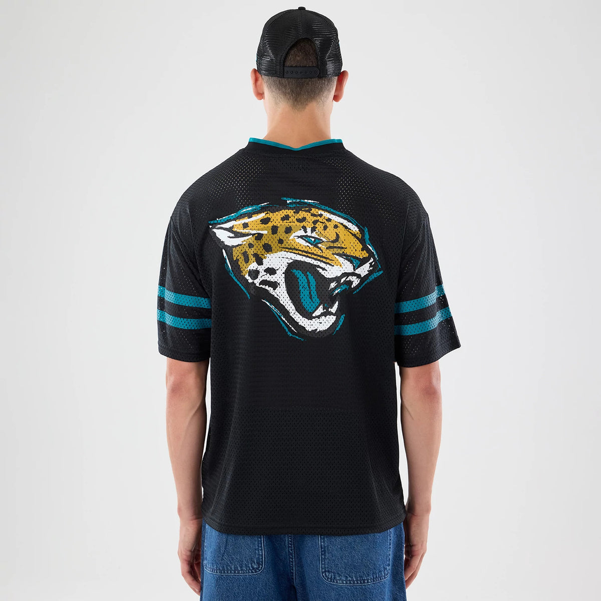 The model is wearing this NFL International Games 2026 Graphic Jacksonville Jaguars Mesh Jersey in black. 2