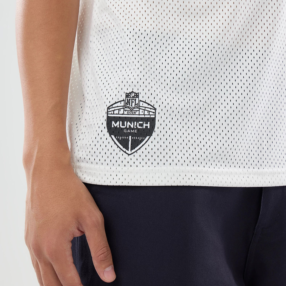 The model is wearing this NFL International Games 2026 Graphic Detroit Lions Mesh Jersey in white. 4