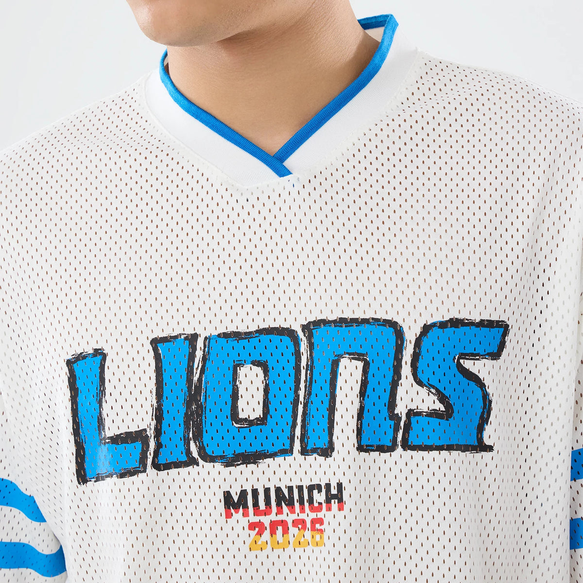 The model is wearing this NFL International Games 2026 Graphic Detroit Lions Mesh Jersey in white. 6