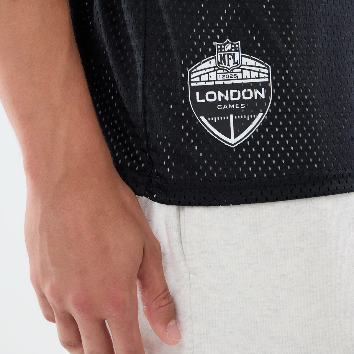 The model is wearing this NFL International Games 2026 Graphic Washington Commanders Mesh Jersey in black. 5