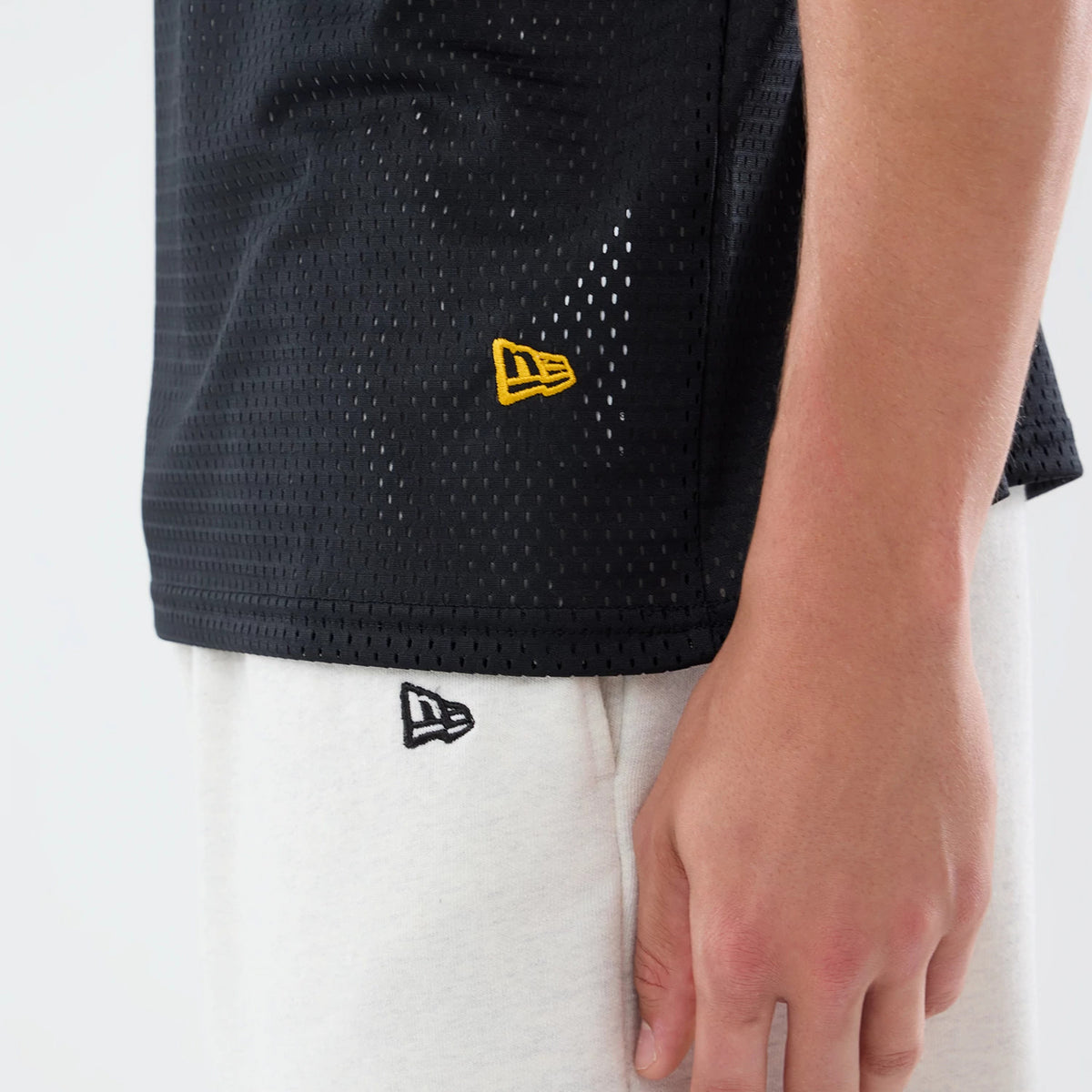The model is wearing this NFL International Series Games 2026 Graphic Washington Commanders Mesh Jersey in black. 6